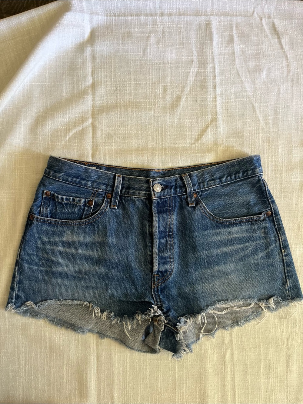 Levi's Medium Blue Frayed Hem Denim Cutoff Shorts